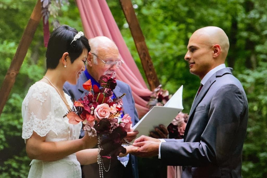 A couple at the wedding altar.